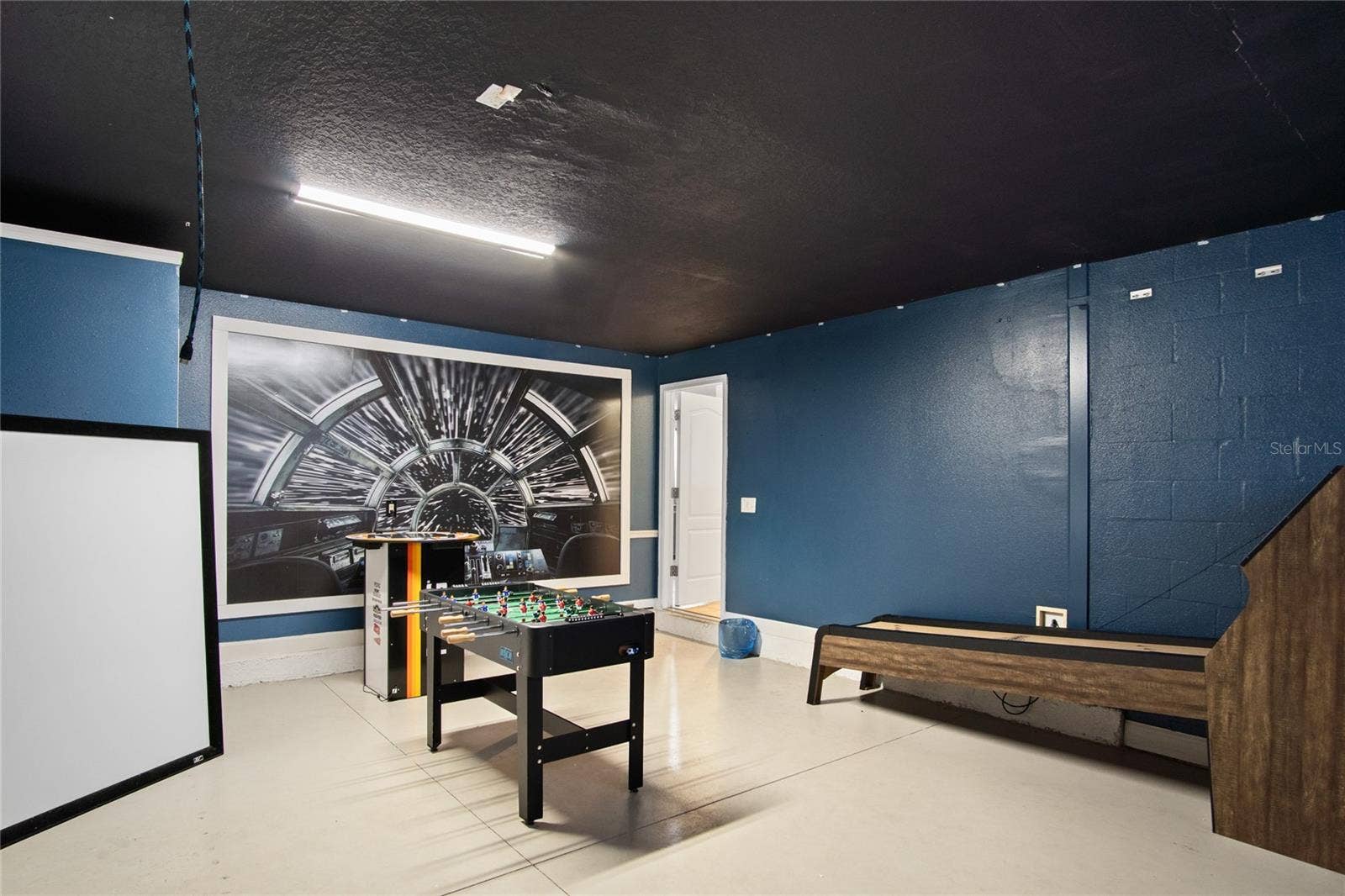 1464 MOON VALLEY DRIVE, Davenport, FL 33896 Down time from the community pool or theme parks can be in the personal game room in the converted garage.