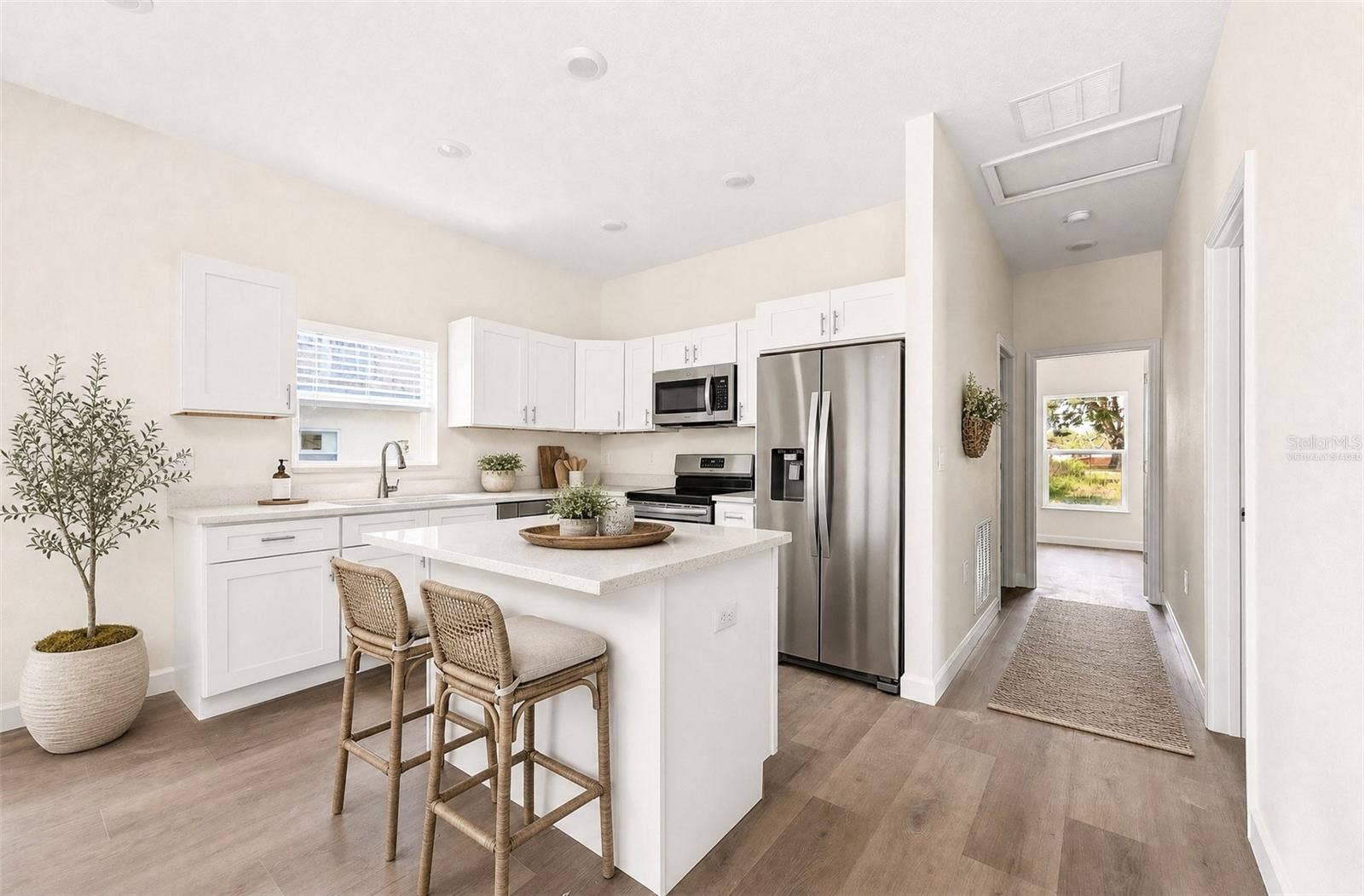 702 LUCKY STREET, Titusville, FL 32780 Modern open kitchen. Virtually Staged.
