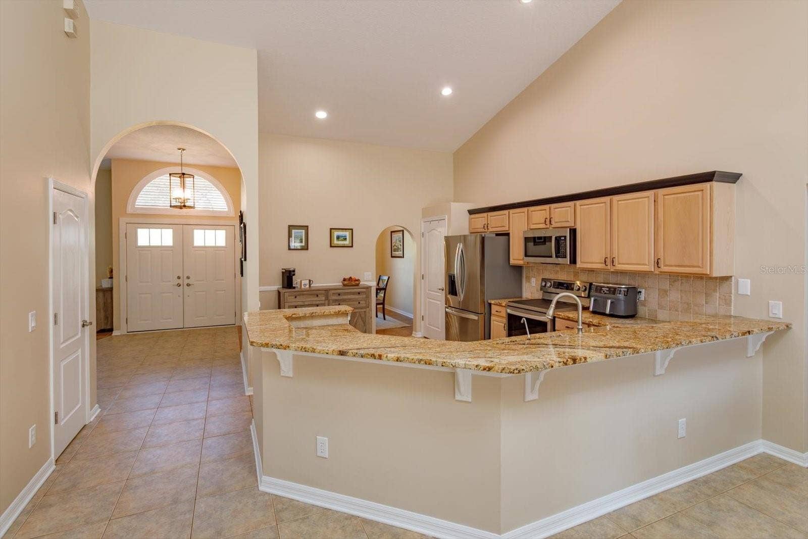 6887 HIDDEN GLADE PLACE, Sanford, FL 32771 Expansive granite counters with backsplash