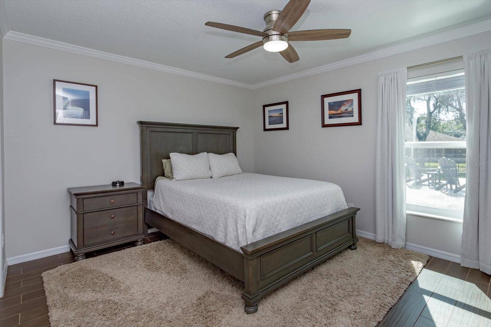 6887 HIDDEN GLADE PLACE, Sanford, FL 32771 Freshly painted bedroom 2 features new fan, new blinds and wood look tile floors