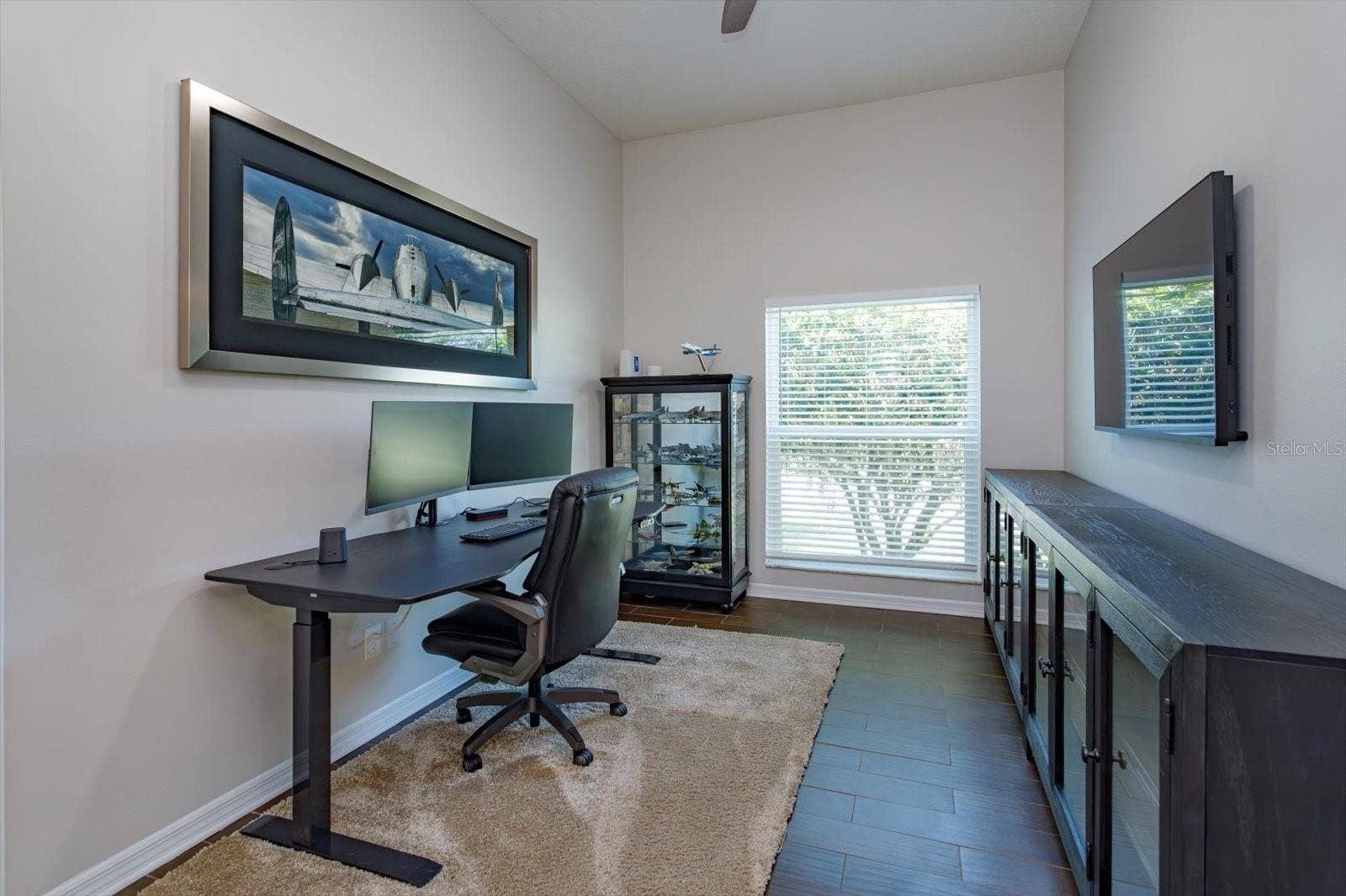 6887 HIDDEN GLADE PLACE, Sanford, FL 32771 Freshly painted bedroom 4 with new blinds, new fan and wood look tile floors