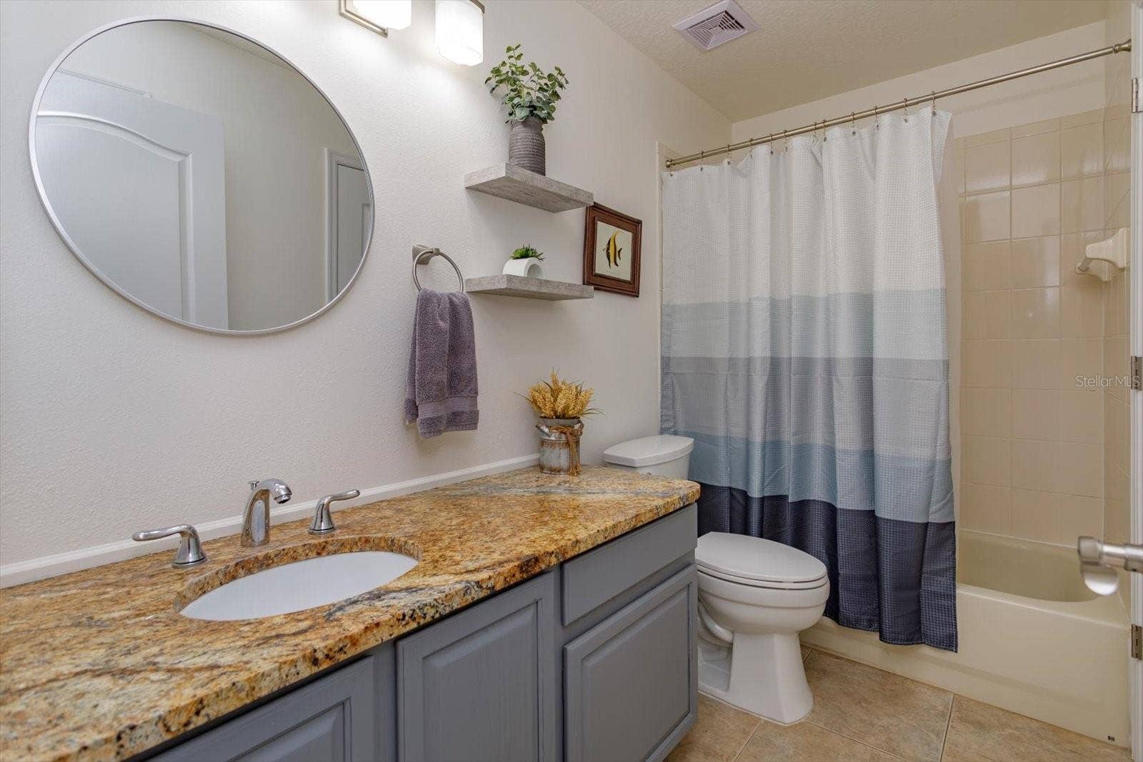 6887 HIDDEN GLADE PLACE, Sanford, FL 32771 Updated guest bathroom with granite counters
