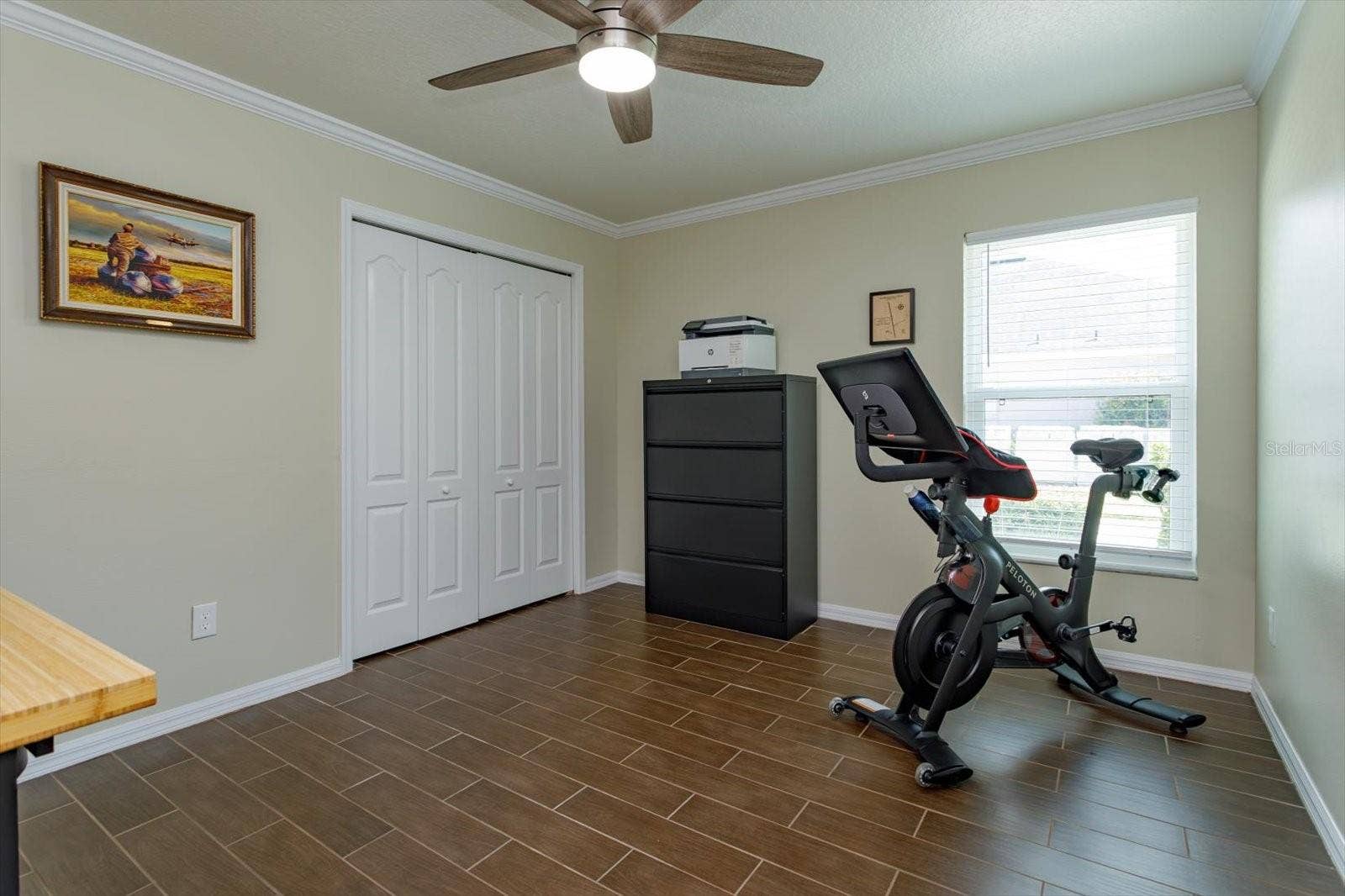 6887 HIDDEN GLADE PLACE, Sanford, FL 32771 Freshly painted bedroom 3 features new fan, new blinds and wood look tile floors