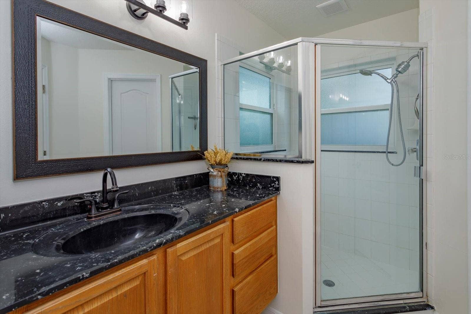6887 HIDDEN GLADE PLACE, Sanford, FL 32771 His primary bathroom features walk in shower and private water closet