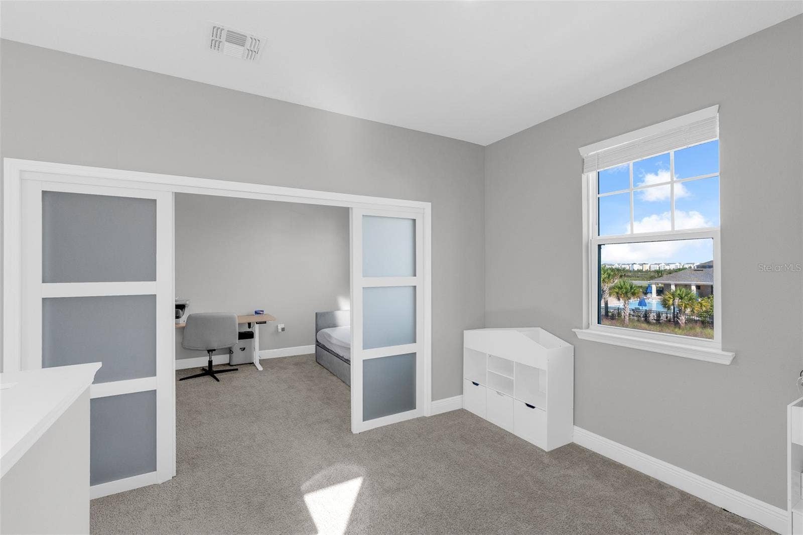 14026 FRASIER STREET, Winter Garden, FL 34787 Versatile upstairs loft with sliding doors
