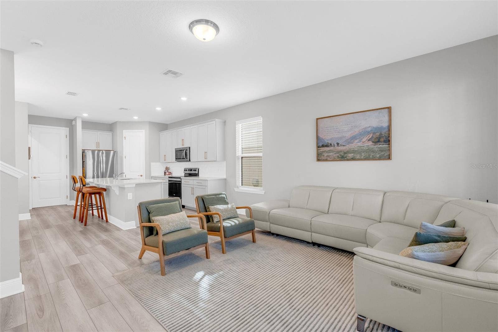 14026 FRASIER STREET, Winter Garden, FL 34787 Living room with an open layout and natural light