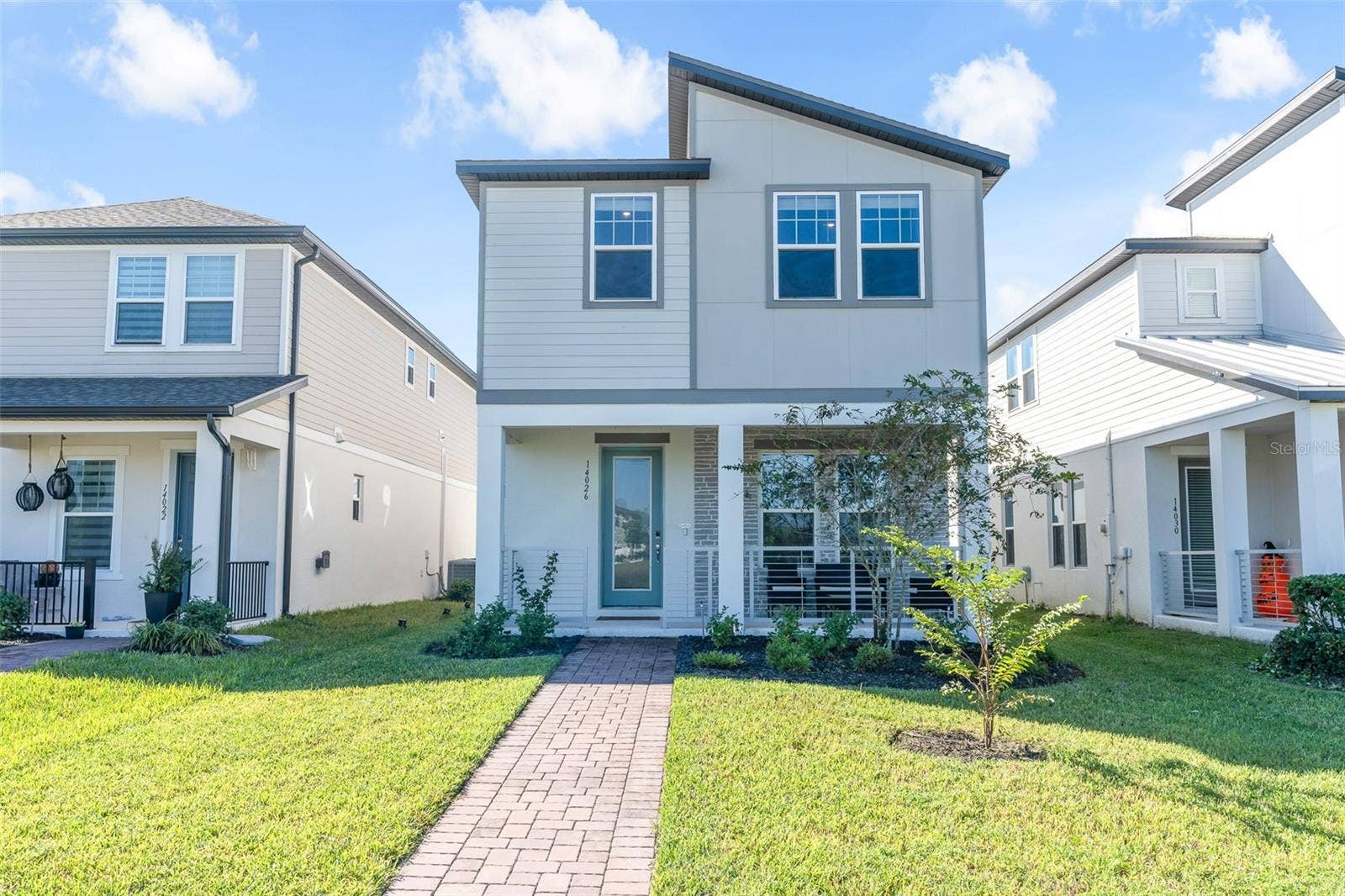 14026 FRASIER STREET, Winter Garden, FL 34787 Front exterior with inviting covered porch