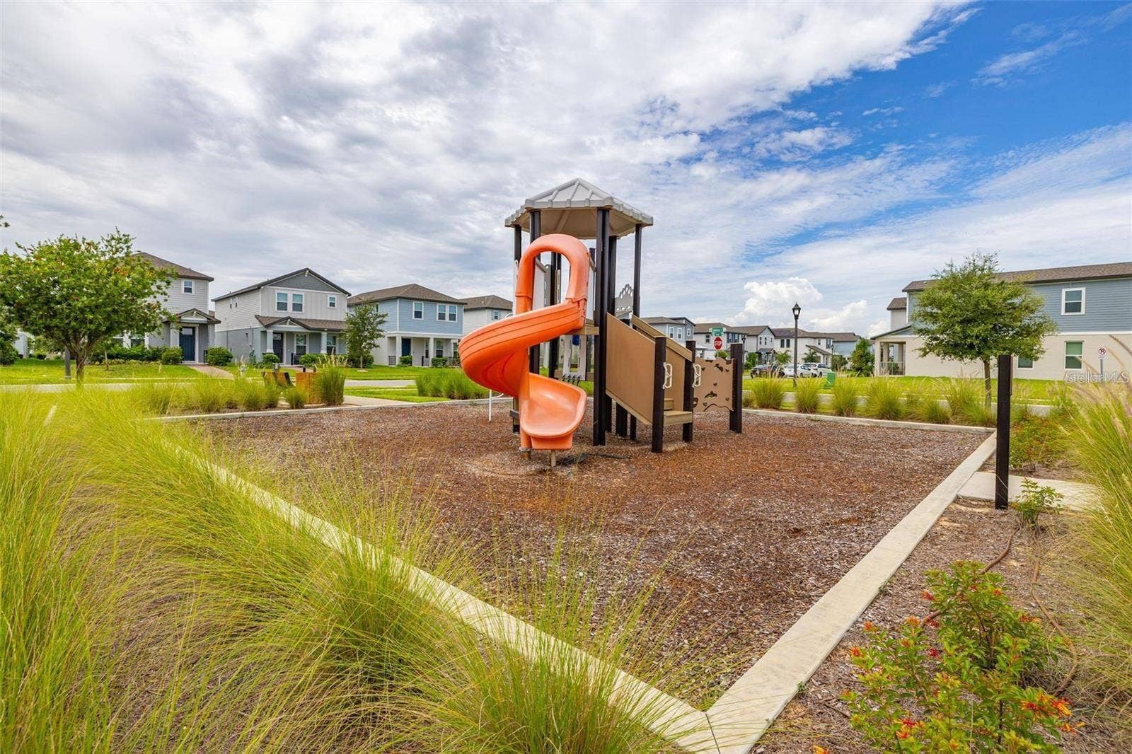 14026 FRASIER STREET, Winter Garden, FL 34787 Community playground with slides and climbing features.
