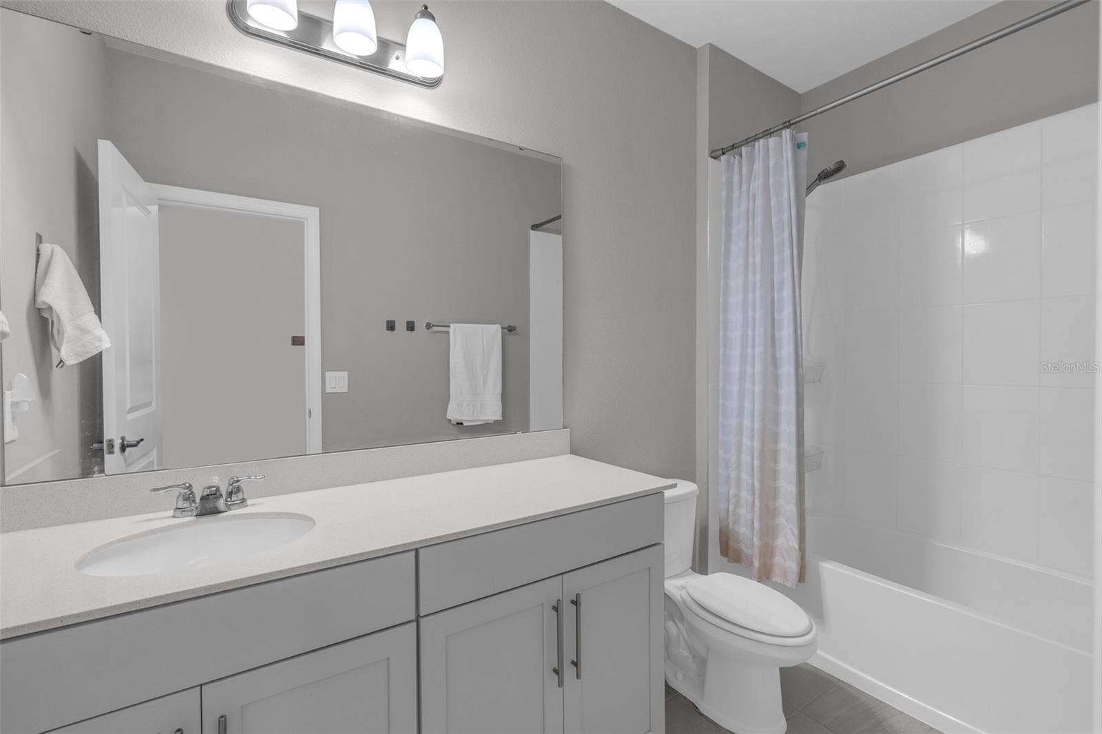 14026 FRASIER STREET, Winter Garden, FL 34787 Full bathroom with vanity and tub/shower combination