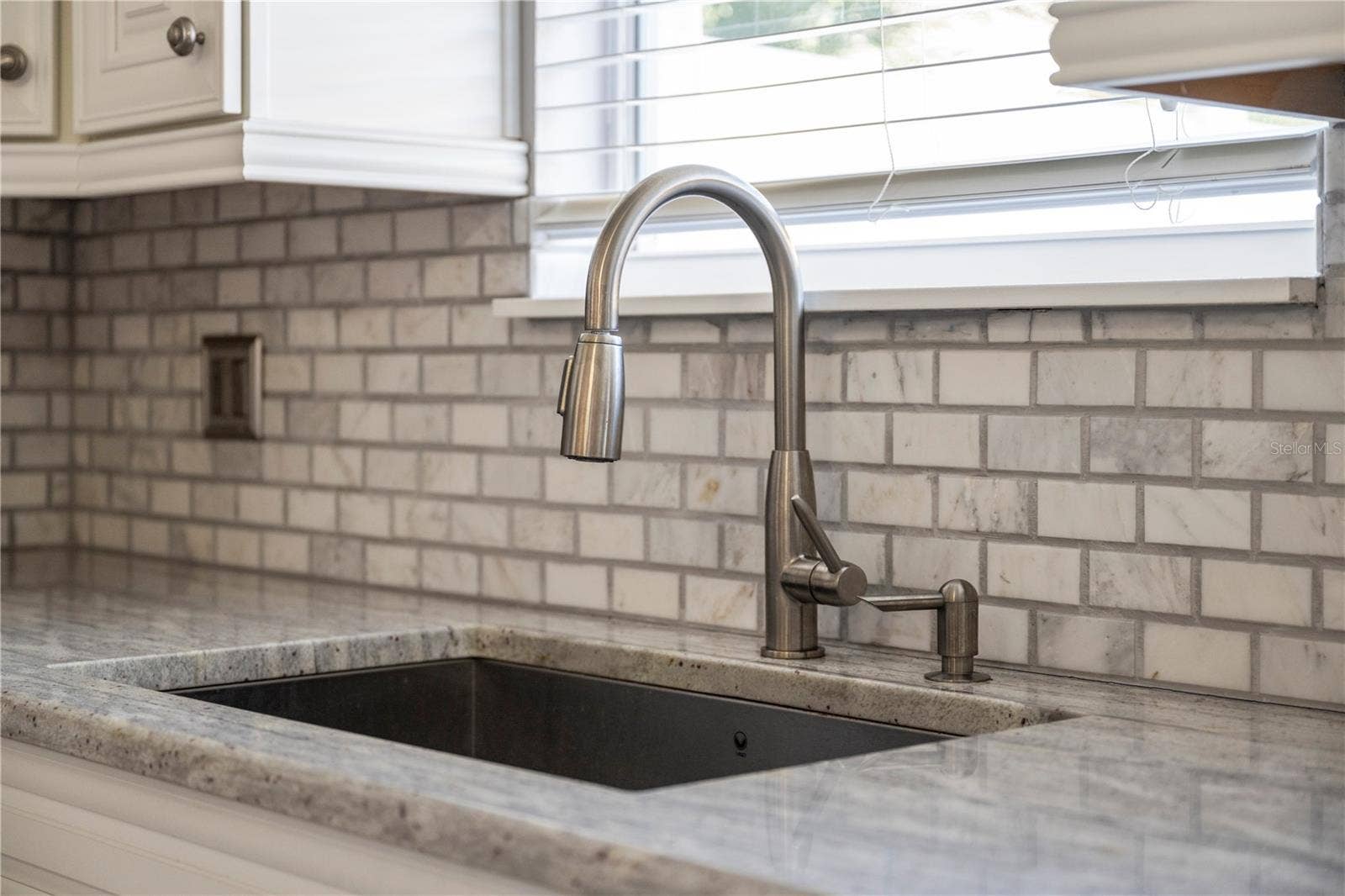 8516 DANFORTH DRIVE, Windermere, FL 34786 Kitchen sink overlooking courtyard patio