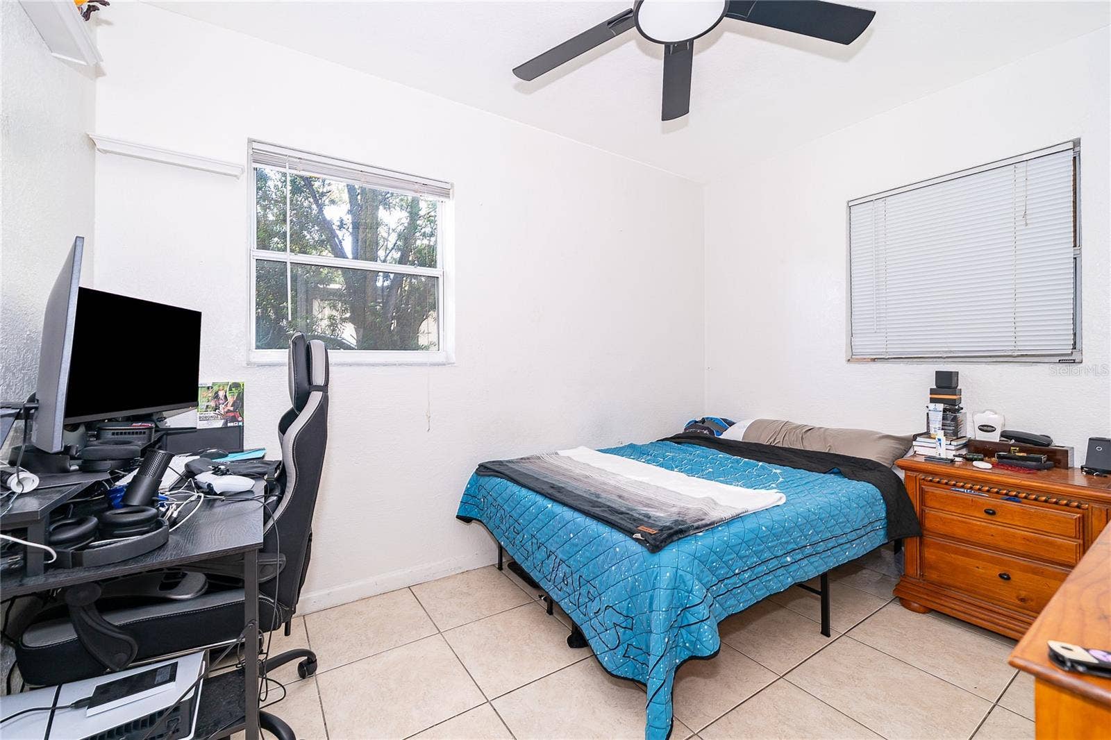 800 DORADO AVENUE, Orlando, FL 32807 This versatile bedroom offers flexibility for guests, a home office, or additional living space to suit your needs.