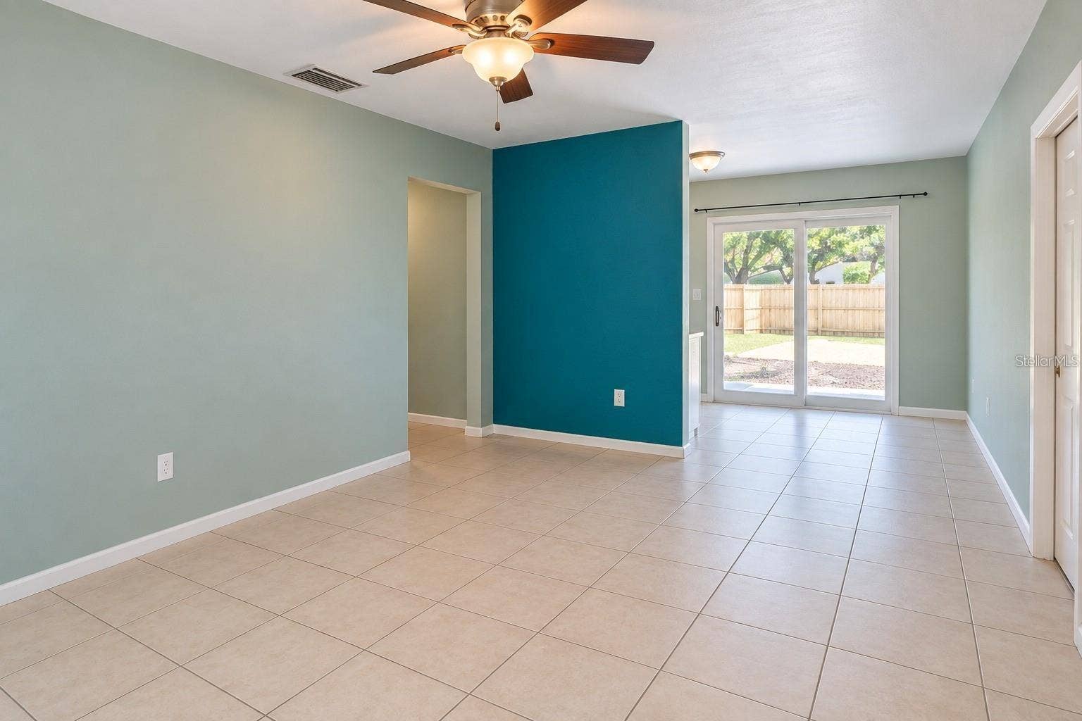 800 DORADO AVENUE, Orlando, FL 32807 Step inside to a bright and inviting living space with an open feel, perfect for relaxing after a long day or welcoming guests.