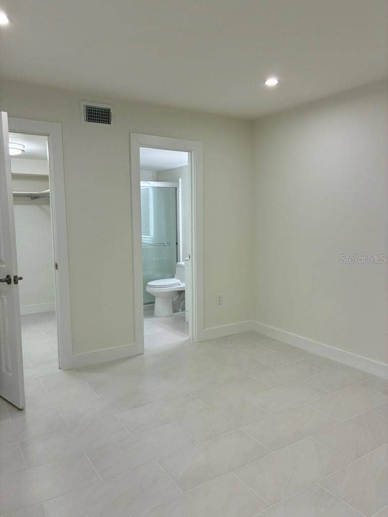 5999 VILLAGE CIRCLE, #990, Orlando, FL 32822 Master bedroom bath and walk-in closet