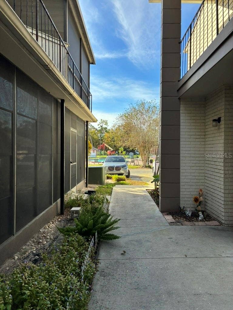5999 VILLAGE CIRCLE, #990, Orlando, FL 32822 Alleyway looking towards parking lot