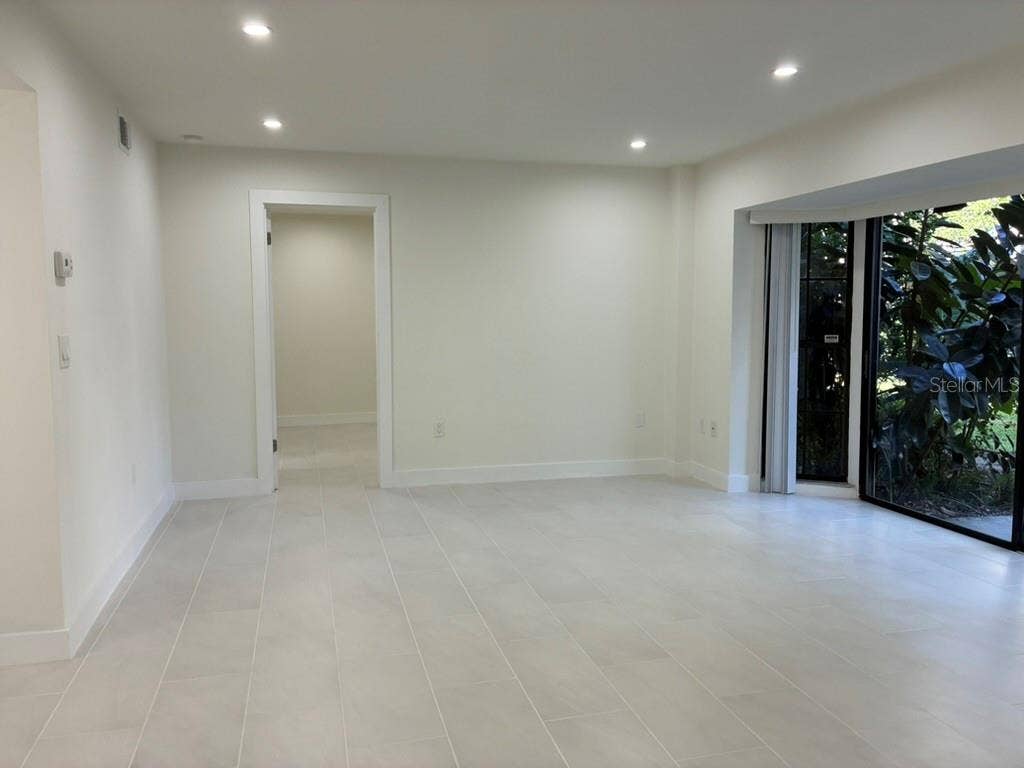 5999 VILLAGE CIRCLE, #990, Orlando, FL 32822 Living room and porch on left hand side
