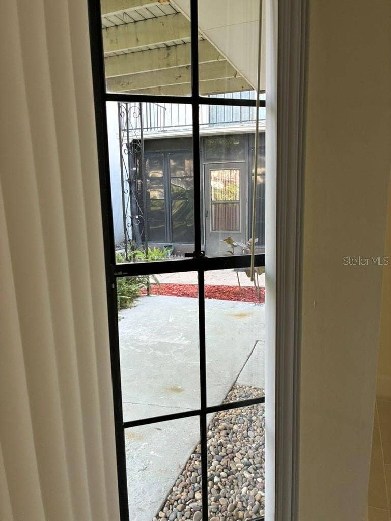 5999 VILLAGE CIRCLE, #990, Orlando, FL 32822 Side window overlooking Bedroom 2 patio