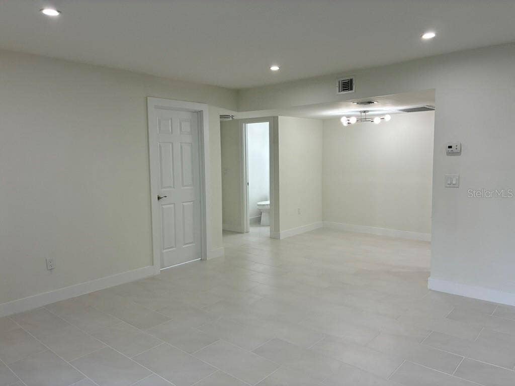 5999 VILLAGE CIRCLE, #990, Orlando, FL 32822 Living room looking in from Rear porch