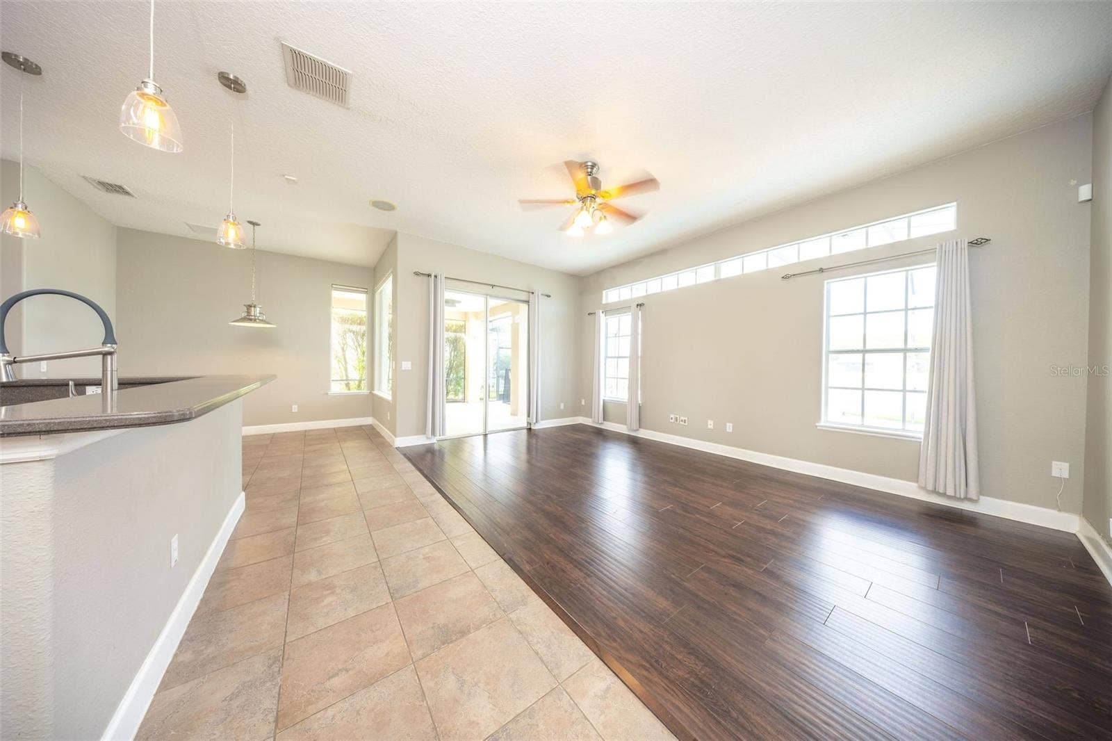 1726 ASTOR FARMS PLACE, Sanford, FL 32771 Family Room with Slider to Lanai/Pool