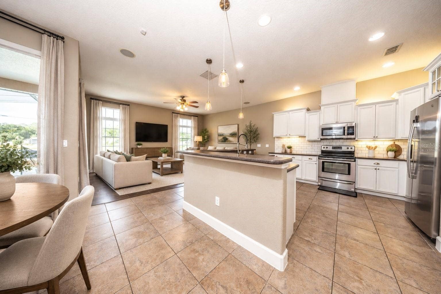 1726 ASTOR FARMS PLACE, Sanford, FL 32771 Kitchen/Family room combo with eat-in space (virtually staged)