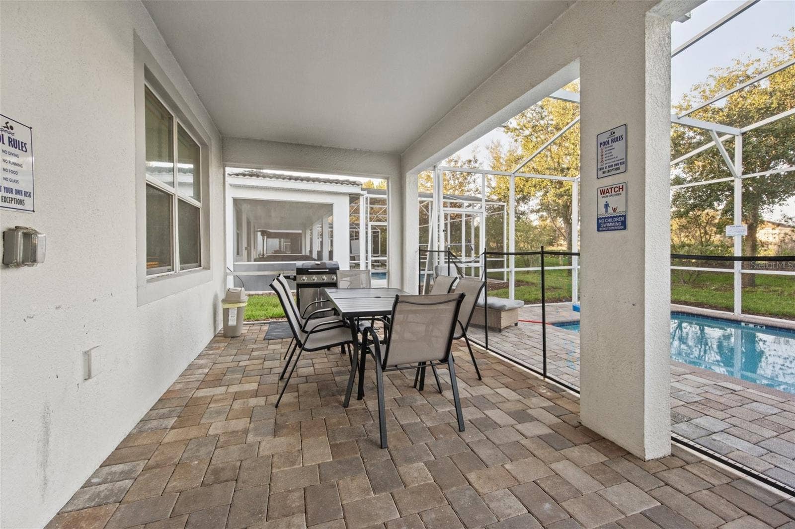 1540 MAIDSTONE COURT, Davenport, FL 33896 Covered lanai dining
