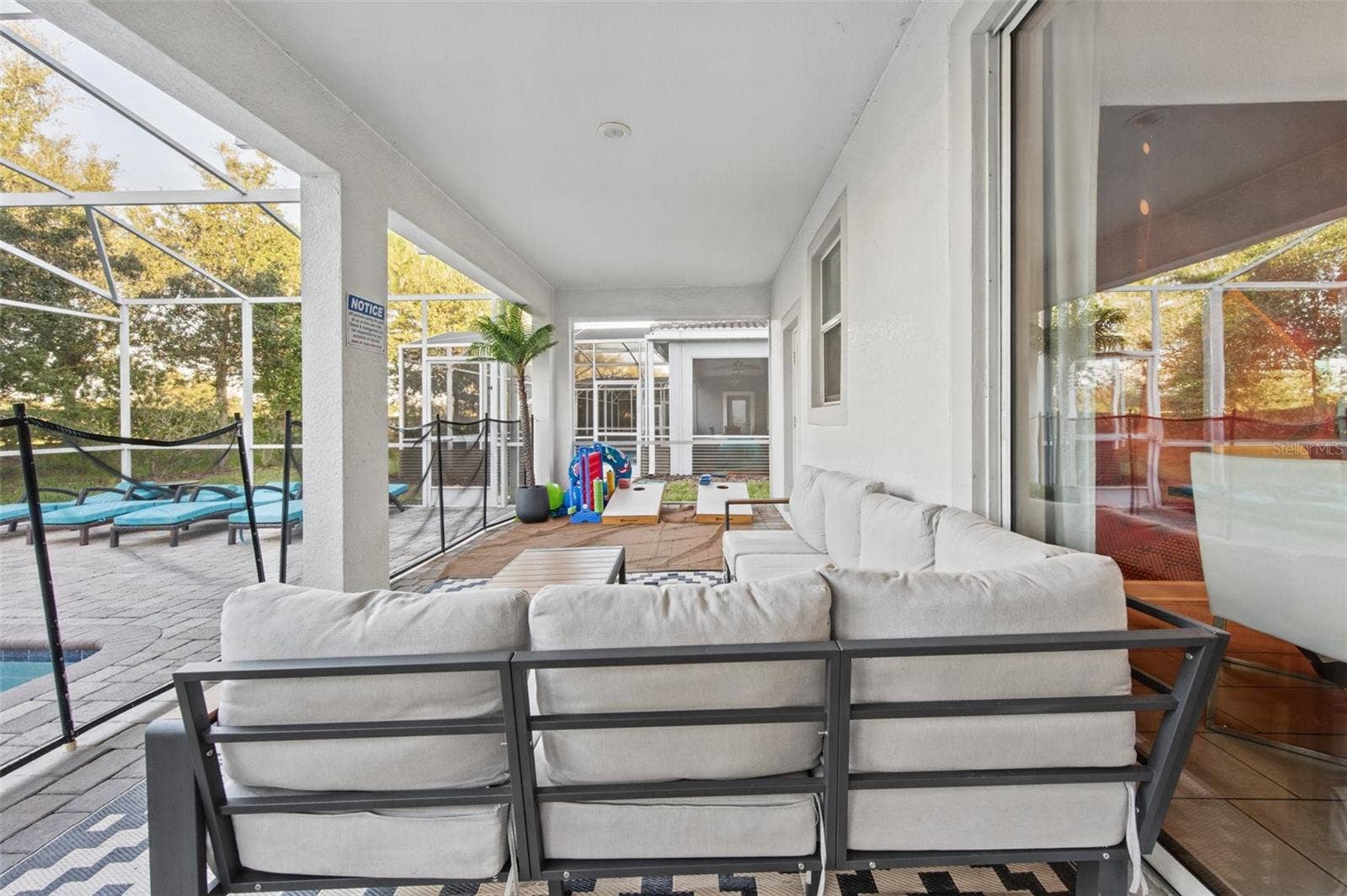 1540 MAIDSTONE COURT, Davenport, FL 33896 Covered lanai lounge