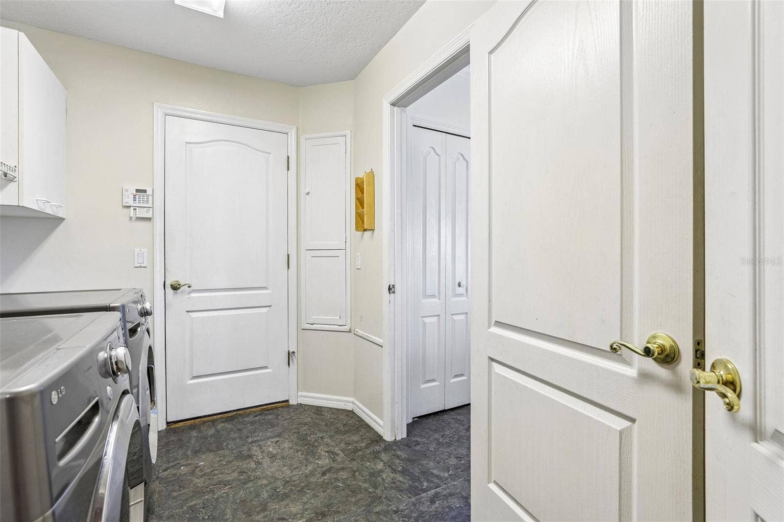 7891 BRIDGESTONE DRIVE, Orlando, FL 32835 Laundry Room