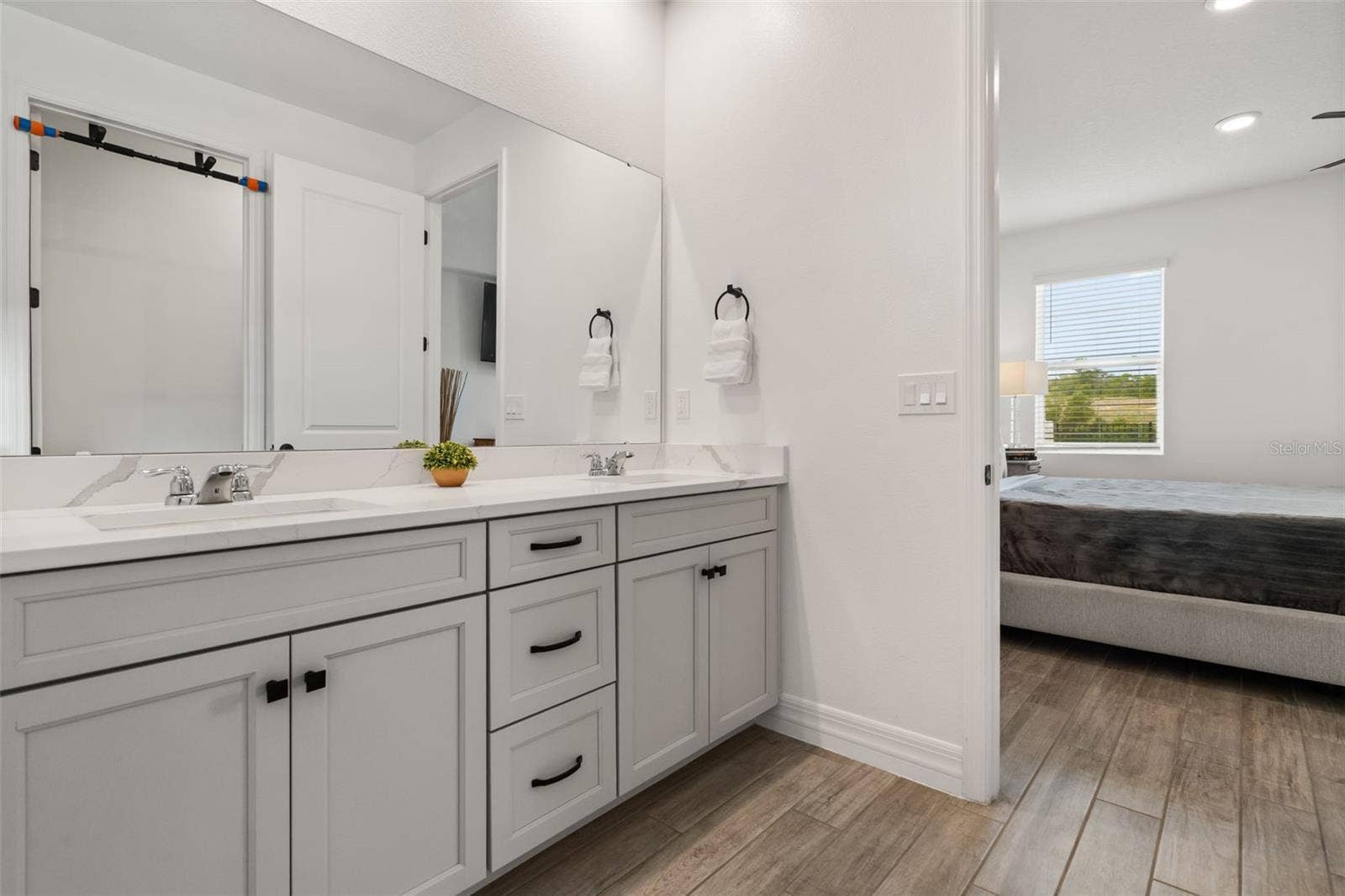 2013 VALENCIA BLOSSOM STREET, Clermont, FL 34711 Primary bathroom at rear of home with view of greenbelt