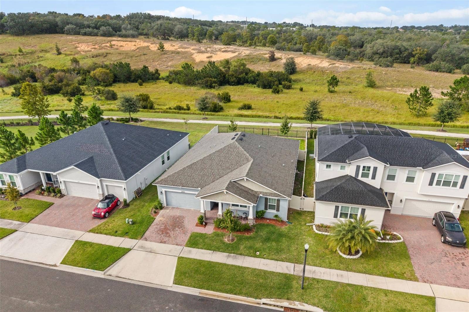2013 VALENCIA BLOSSOM STREET, Clermont, FL 34711 overhead of home backing to greenbelt and walking path to lake