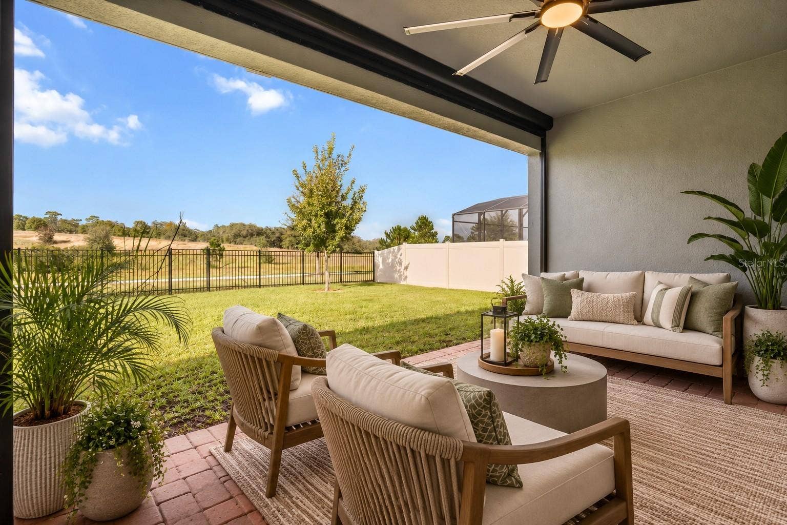 2013 VALENCIA BLOSSOM STREET, Clermont, FL 34711 Back lanai with motorized screen
