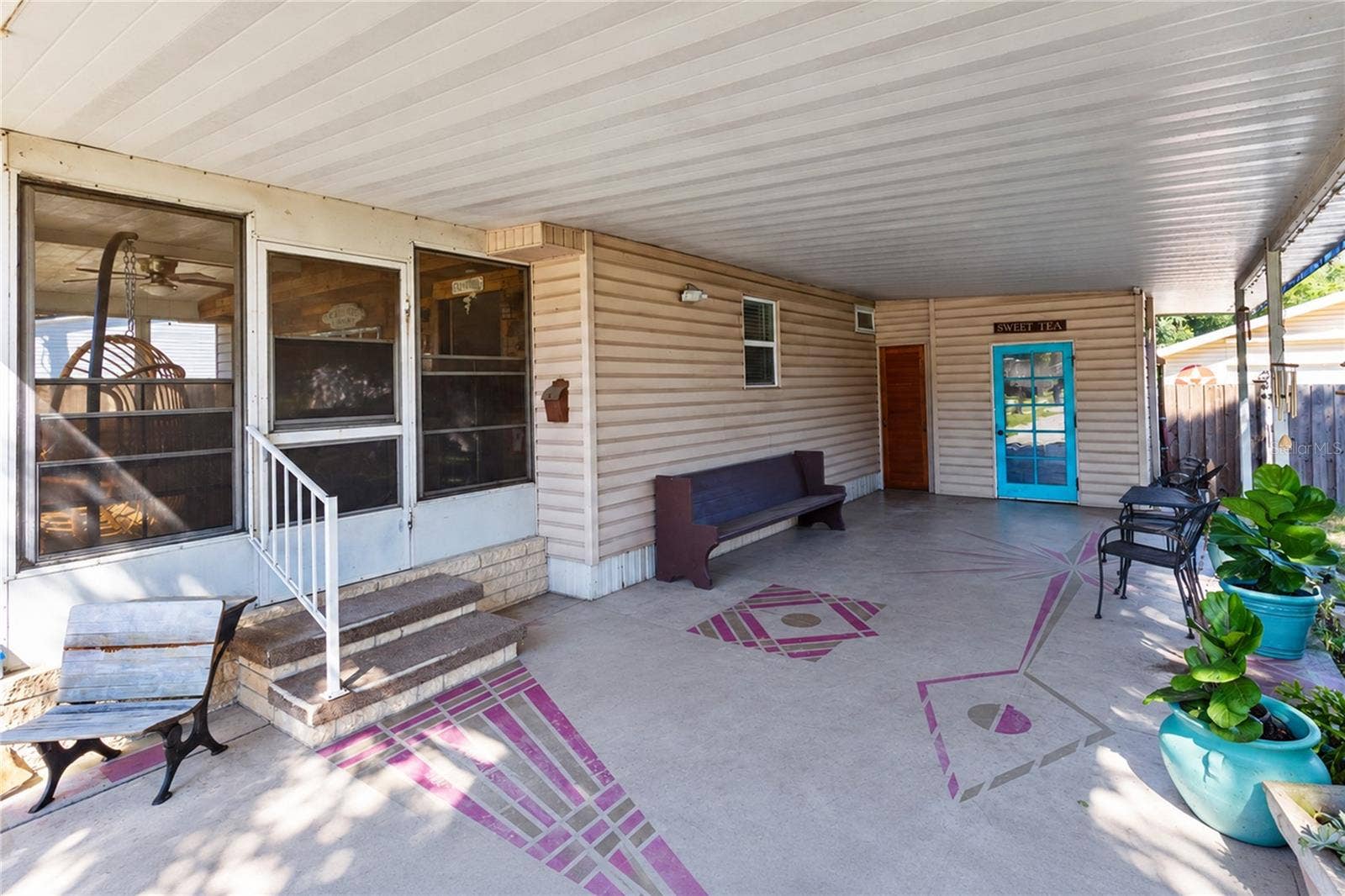 13419 MARYLAND AVENUE, Astatula, FL 34705 Car port.