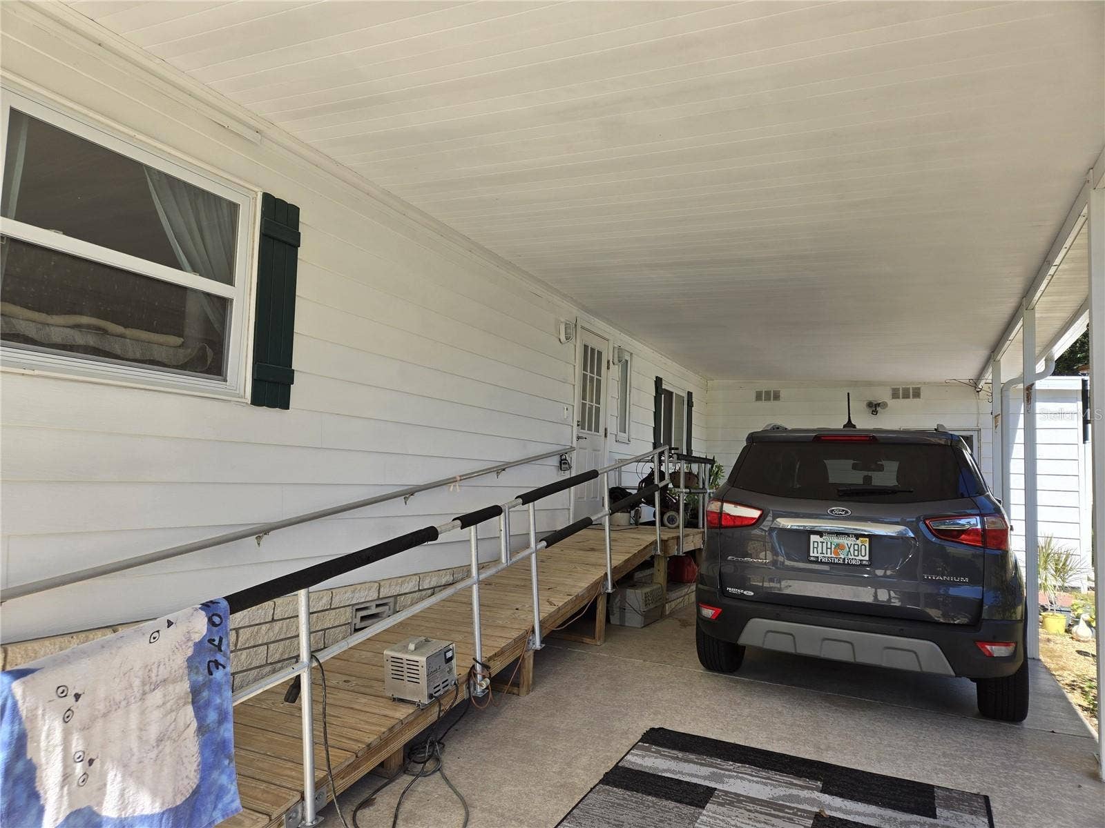 3889 DIAMOND OAK WAY, #493, Zellwood, FL 32798 entry ramp carport