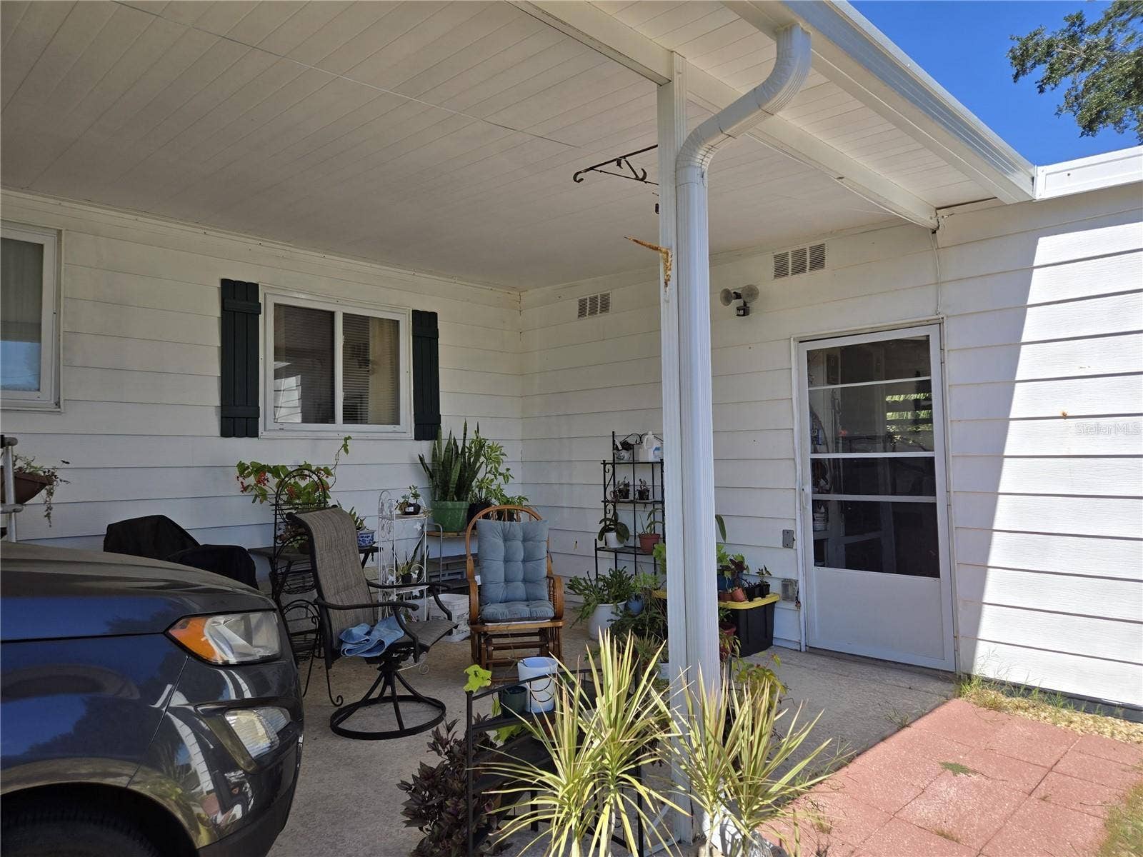 3889 DIAMOND OAK WAY, #493, Zellwood, FL 32798 carport to laundry and storage
