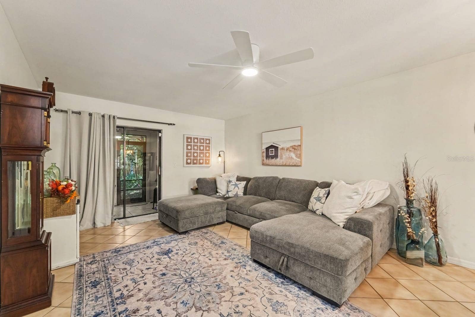 143 CROWN POINT CIRCLE, #143, Longwood, FL 32779 Spacious Living Area Opens to Screened Porch with Comfortable Seating
