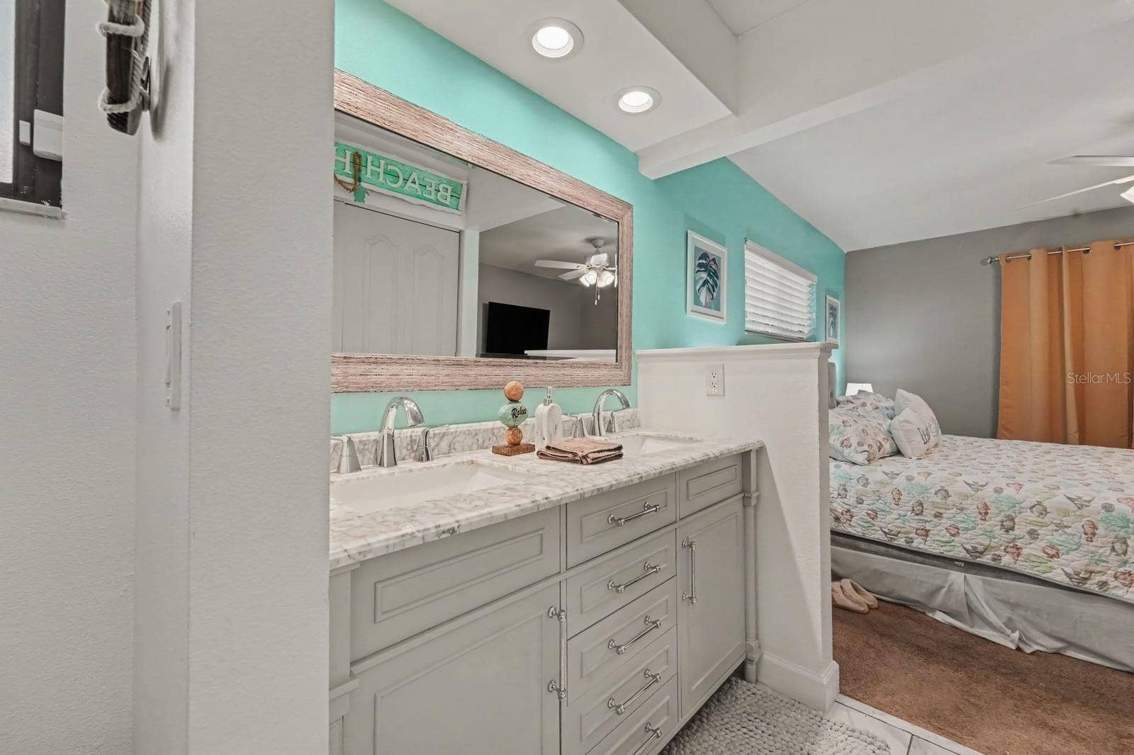 143 CROWN POINT CIRCLE, #143, Longwood, FL 32779 Luxurious spa-style ensuite with dual vanity, marble counters, and walk-in shower