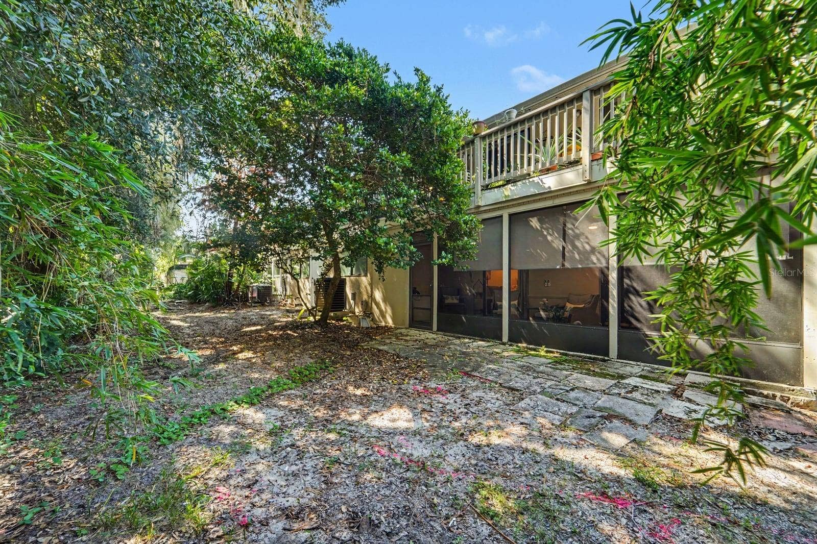 143 CROWN POINT CIRCLE, #143, Longwood, FL 32779 Lush tropical landscaping surrounds the spacious rear exterior and pool area