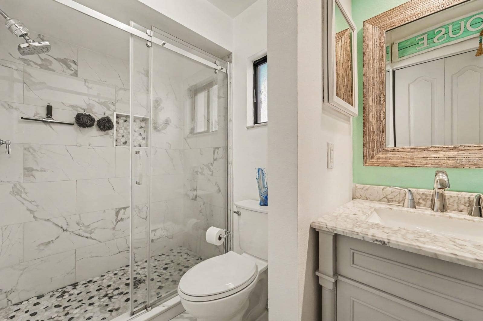 143 CROWN POINT CIRCLE, #143, Longwood, FL 32779 Bright ensuite bathroom with marble finishes and custom cabinetry