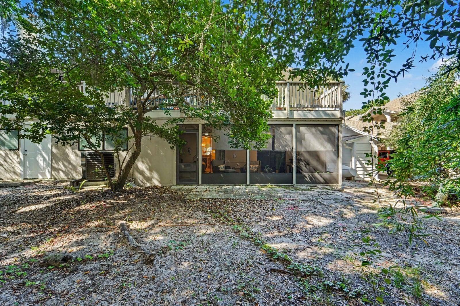 143 CROWN POINT CIRCLE, #143, Longwood, FL 32779 Shaded Rear Courtyard With Modern Screened Patio and Mature Trees