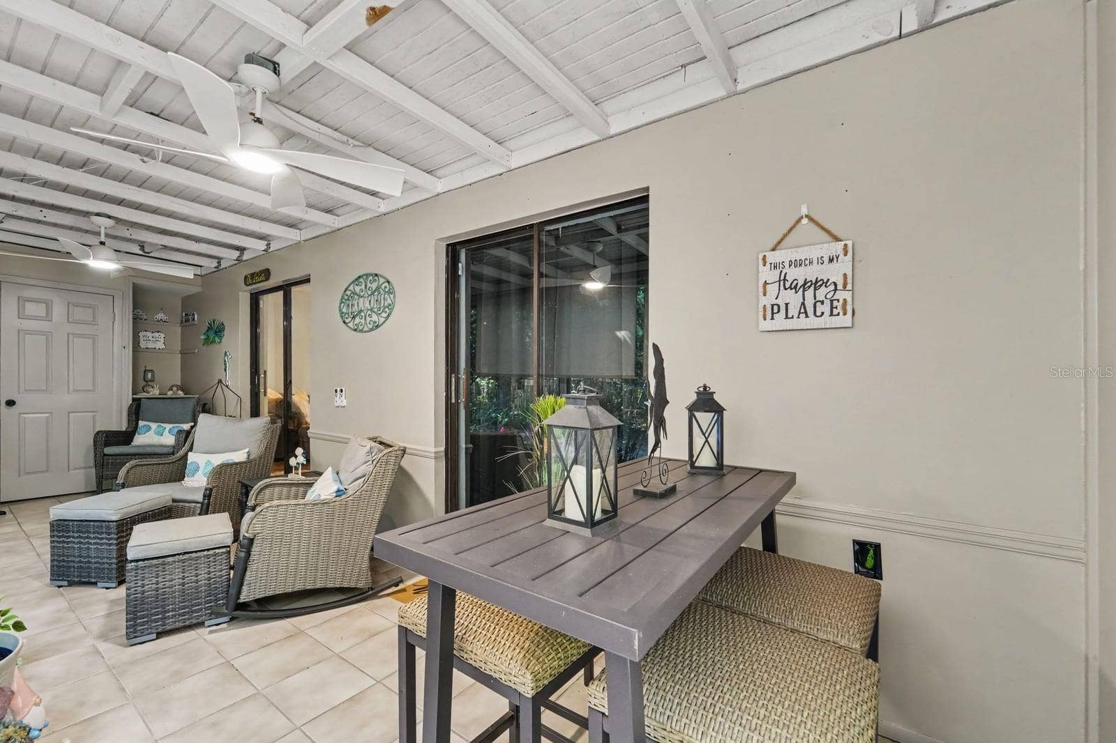 143 CROWN POINT CIRCLE, #143, Longwood, FL 32779 Covered lanai with exposed beam ceiling opens to patioideal for indoor-outdoor living