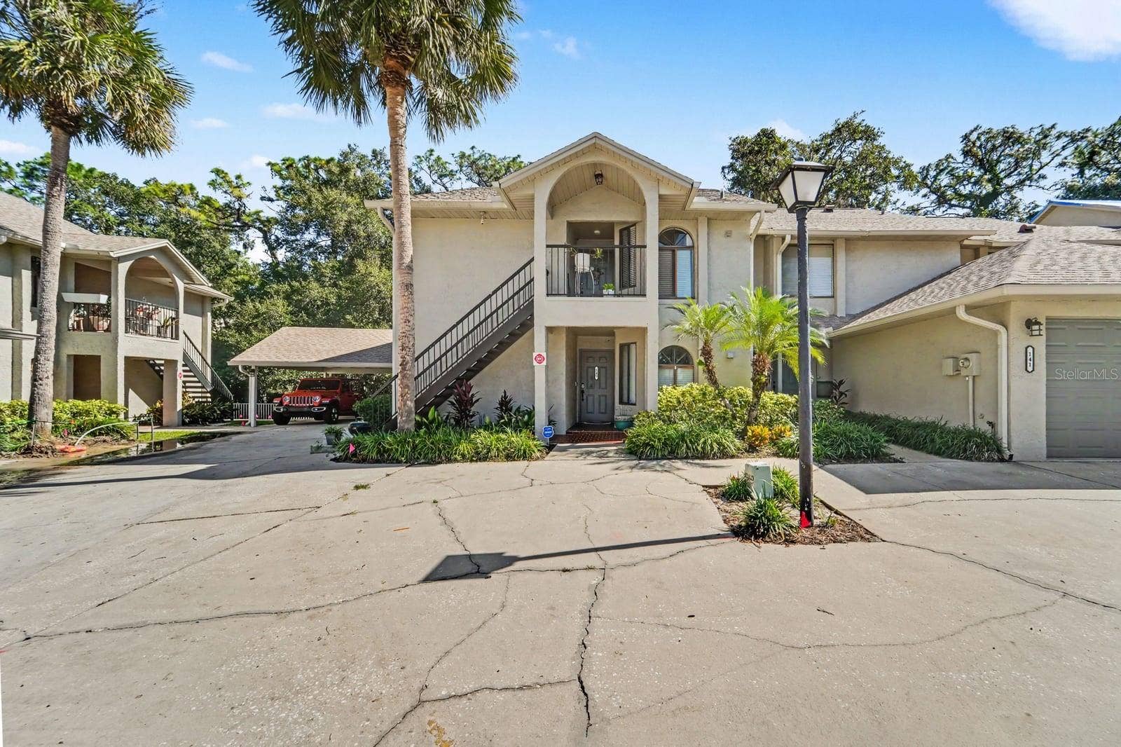 143 CROWN POINT CIRCLE, #143, Longwood, FL 32779 Two-Story Home in Gated Community with Palm Trees and Attached Garage