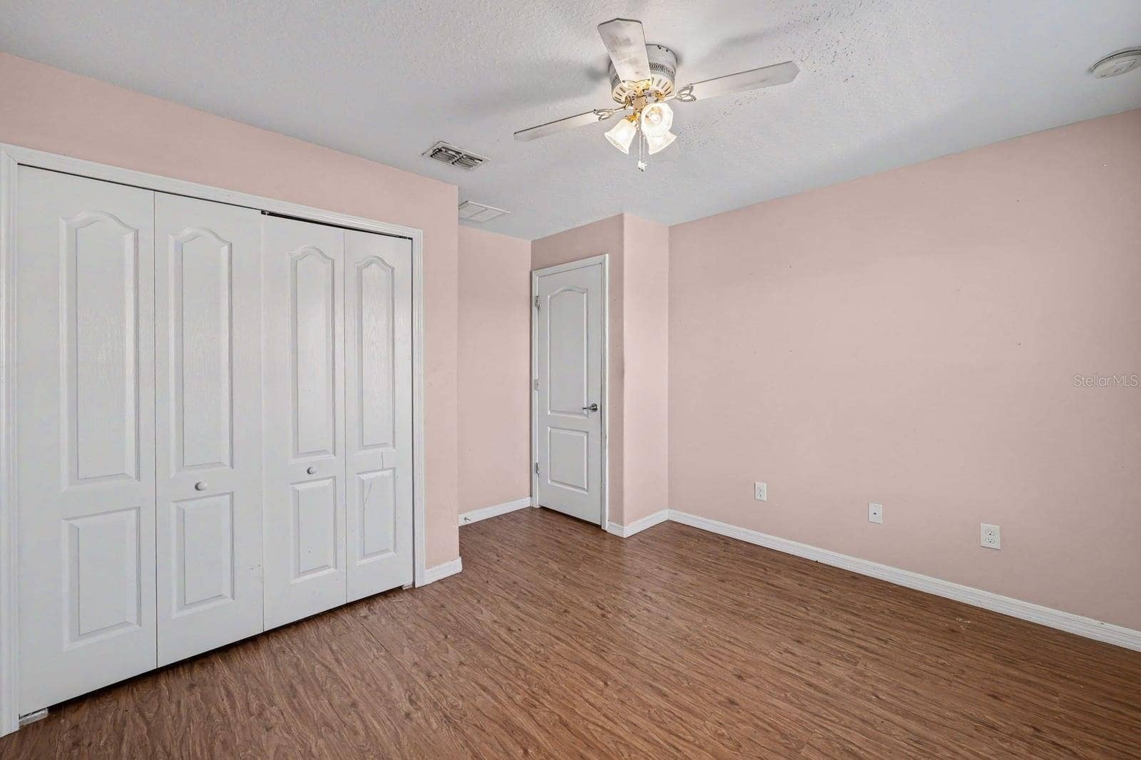 5705 NEW INDEPENDENCE PARKWAY, Winter Garden, FL 34787 Master Bedroom with Multiple Closets, Windows & Wood Flooring