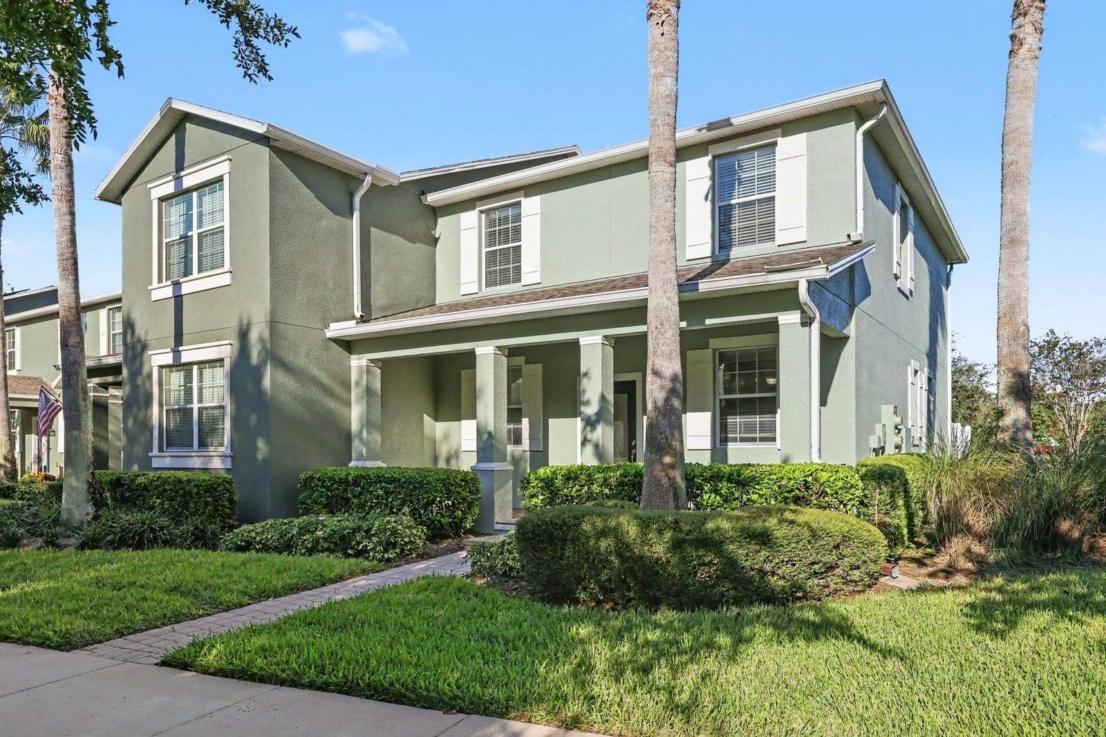 5705 NEW INDEPENDENCE PARKWAY, Winter Garden, FL 34787 Elegant home featuring gabled roofline and mature landscaping