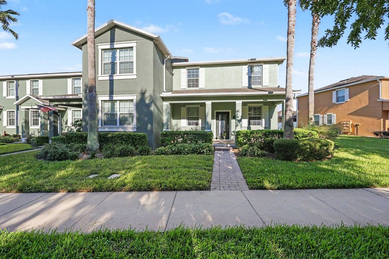 5705 NEW INDEPENDENCE PARKWAY, Winter Garden, FL 34787 Charming two-story home with green exterior and manicured landscaping