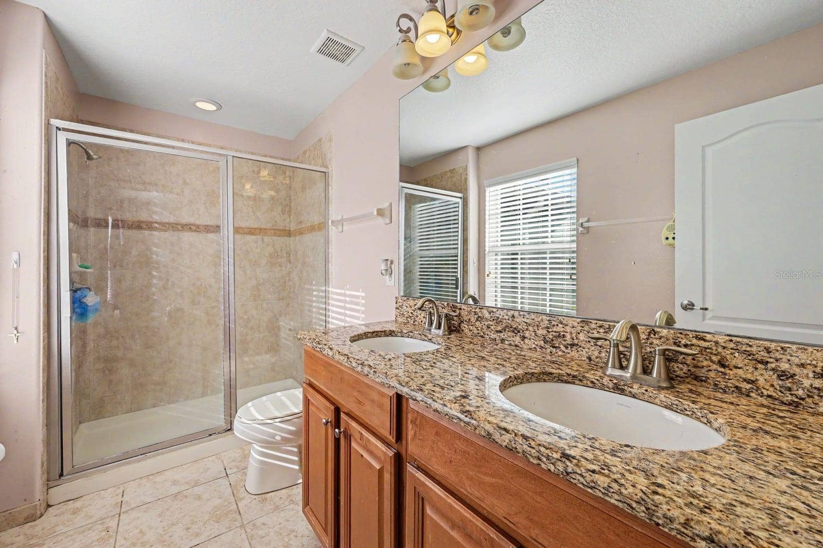 5705 NEW INDEPENDENCE PARKWAY, Winter Garden, FL 34787 Spa-like Master Bath with Dual Vanities, Granite Countertops & Spacious Walk-In Shower