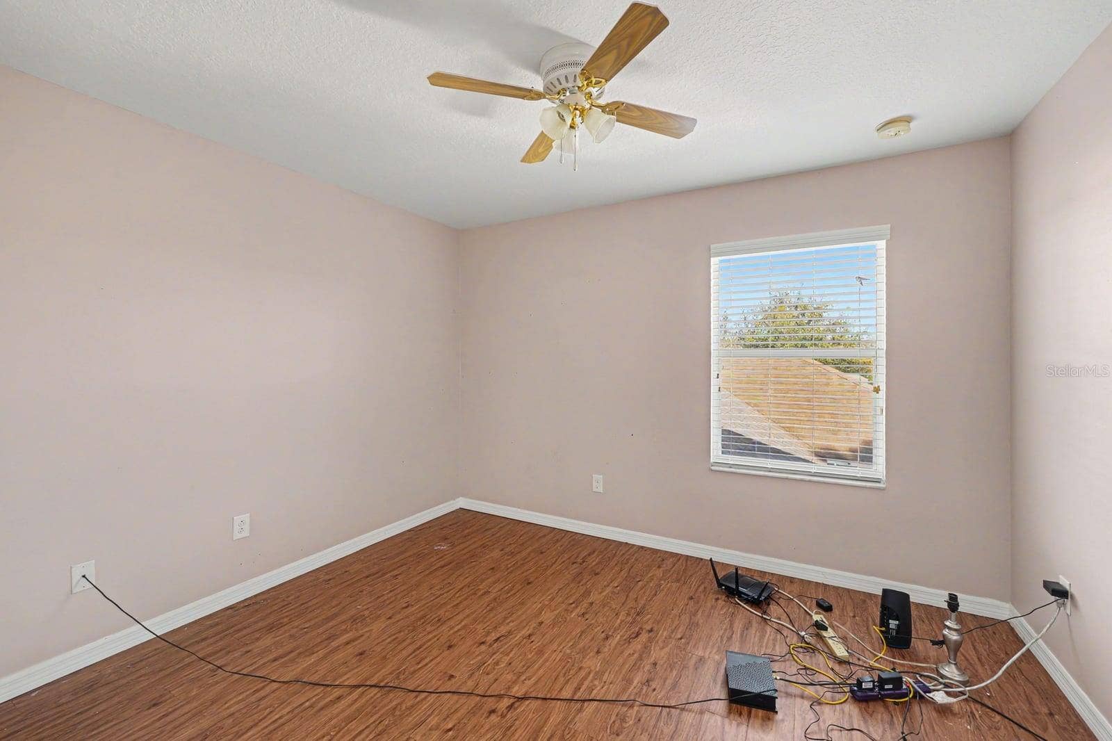 5705 NEW INDEPENDENCE PARKWAY, Winter Garden, FL 34787 Secondary Bedroom With Pink Walls, Wood Floors & Ceiling Fan