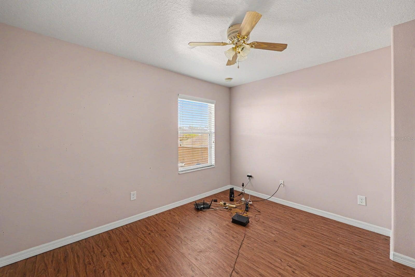 5705 NEW INDEPENDENCE PARKWAY, Winter Garden, FL 34787 Spacious Bedroom with Wood Flooring, Large Window & Ceiling Fan