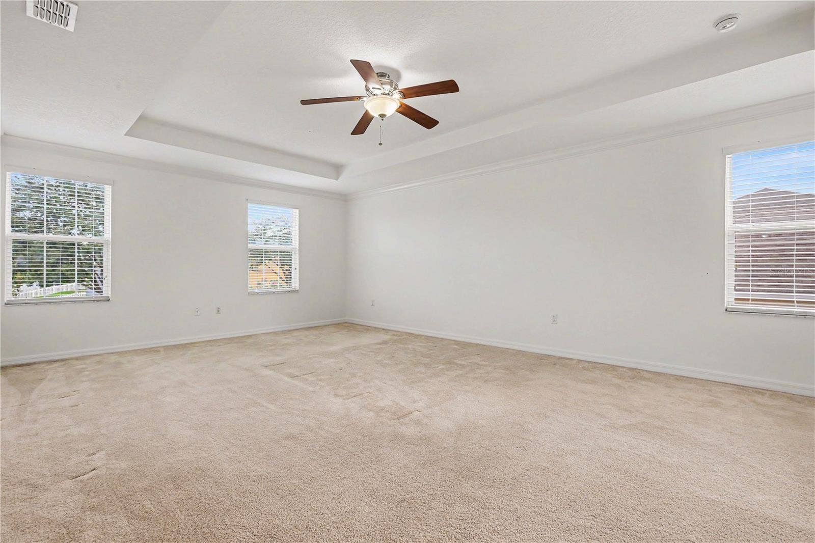 580 L M DAVEY LANE, Titusville, FL 32780 spacious primary master bedroom with tray ceilings on second floor