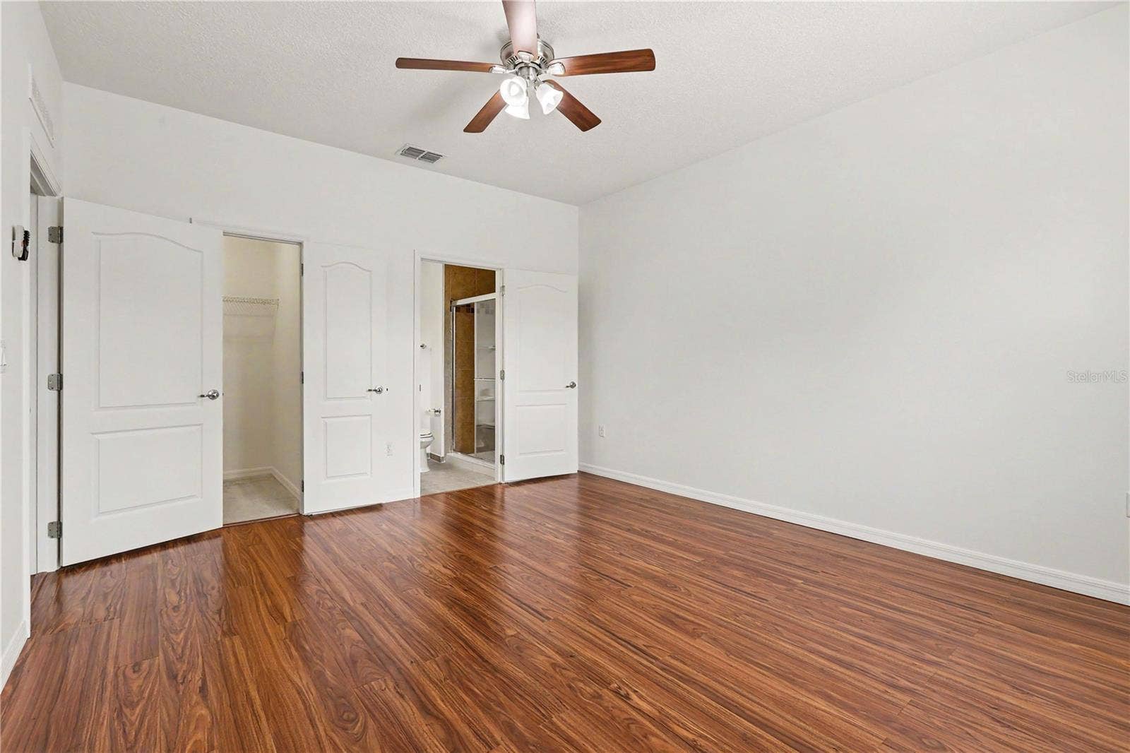 580 L M DAVEY LANE, Titusville, FL 32780 Master Bedroom Suite with vinyl Floors and Ample Closet Space on main floor