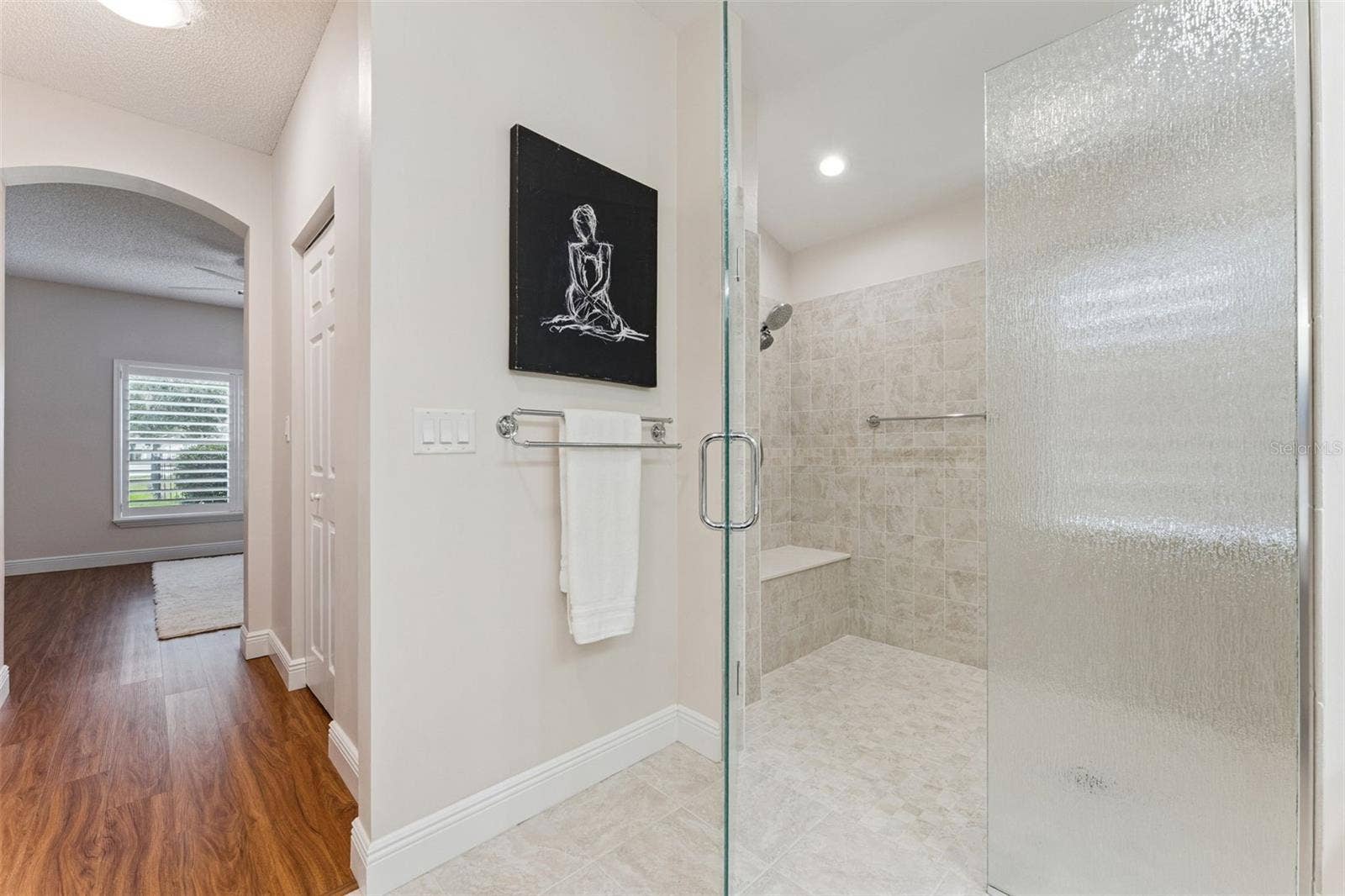 Primary Bathroom walk-in shower w/ bench seat