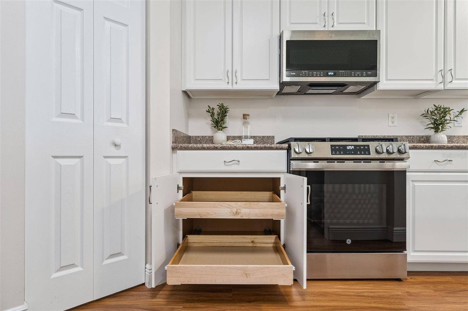 Kitchen cabinets has Pull-out shelving & 2 closet pantry's