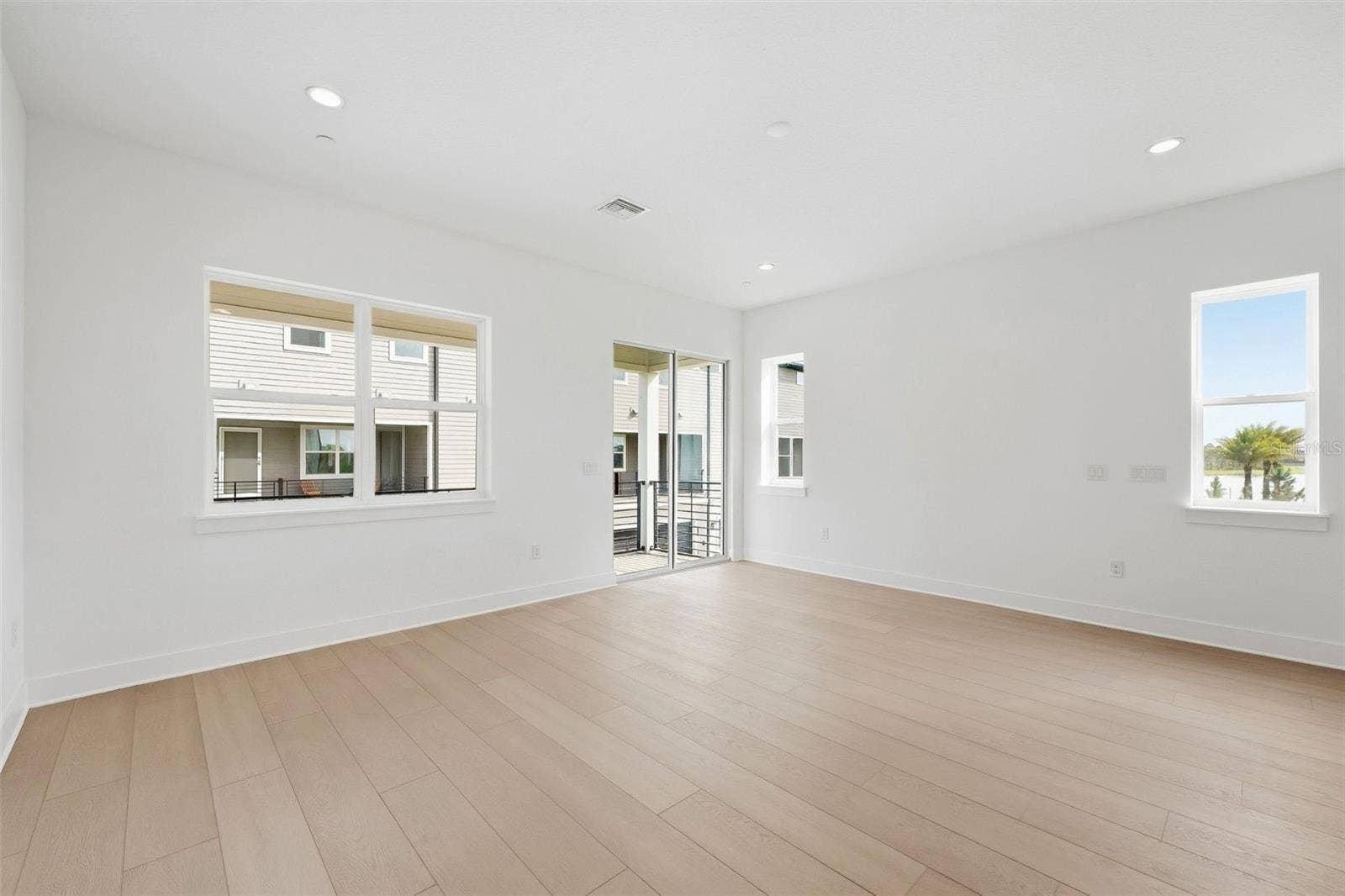 9317 LUMINARY BOULEVARD, Orlando, FL 32827 Great room with 10' ceilings